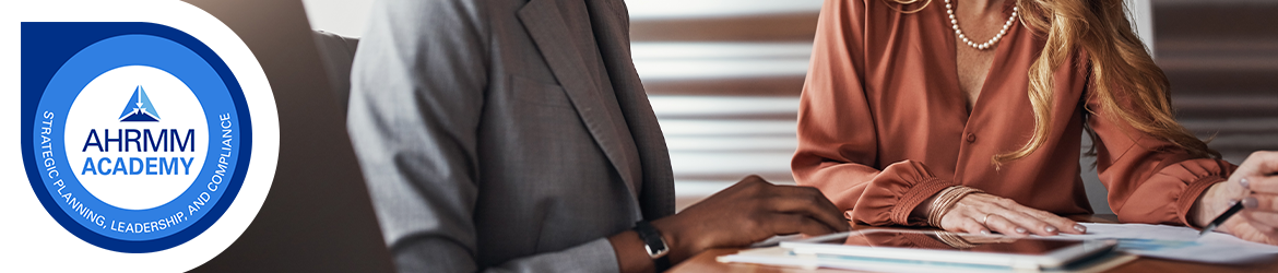 AHRMM Academy badge and image of two professionals sitting at a table in a meeting